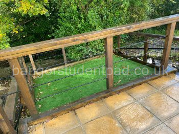 Newly installed 40mm artificial grass on the bottom tier front garden allowing space to relax and chill